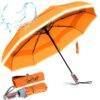 Luxurious folding windproof umbrella for rain - fast drying fabric with real wood handle and vented double canopy orange